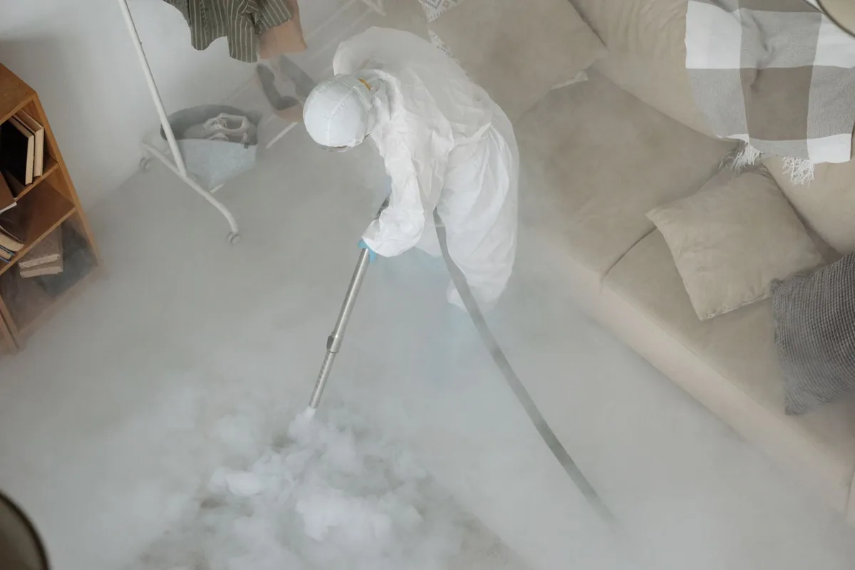 Biohazard cleanup technician in protective equipment, Glendale, New York, NY